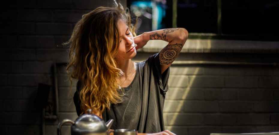 woman sitting beside table